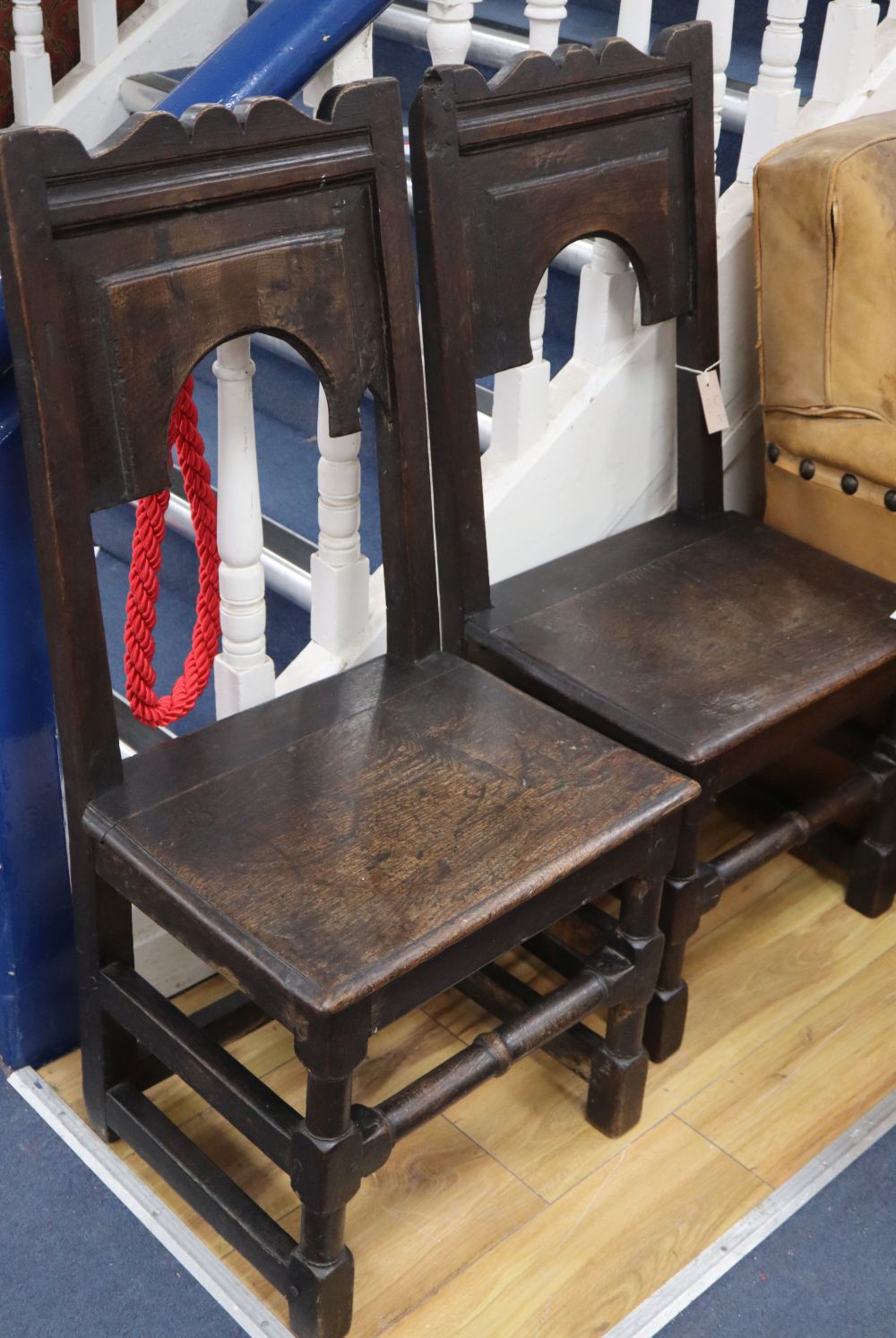 A pair of 17th century oak chair back stools